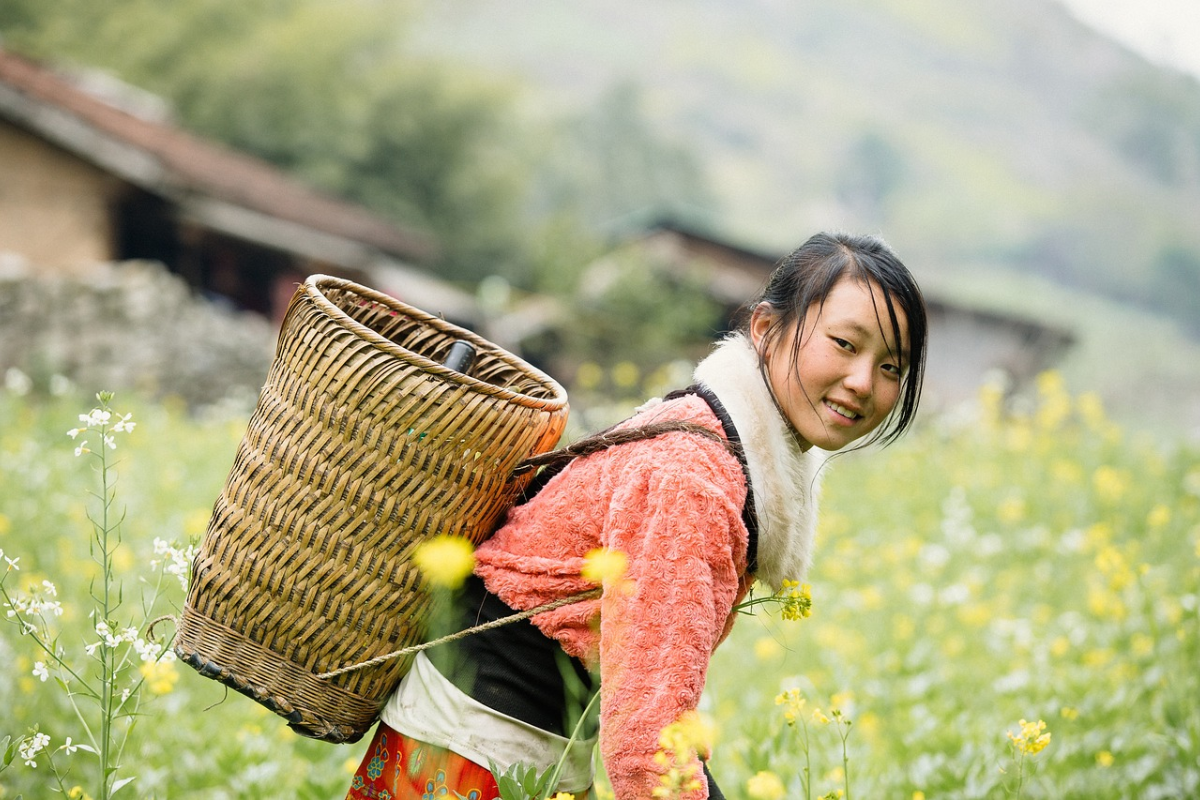 Vietnamese locals smiling and interacting with tourists.